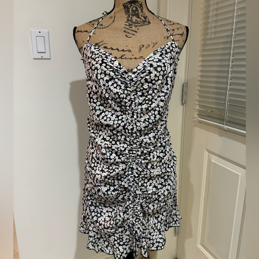 Stunning black and white floral print halter mini dress with adjustable ruching